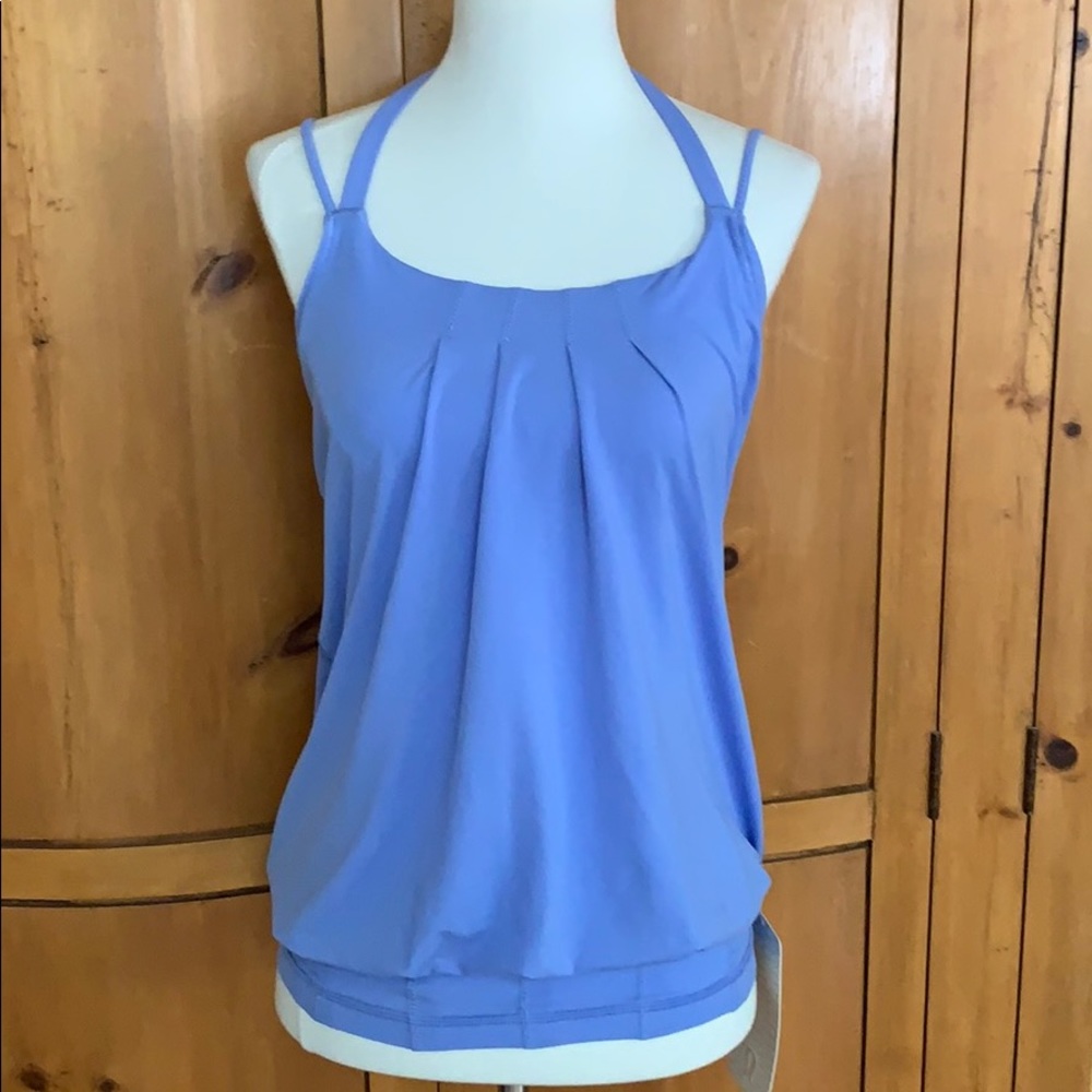 NWT Lululemon Flow and Go tank, size 4. Built in bra, perfect condition.